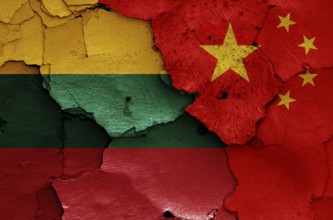 Flags of Lithuania and China painted on cracked wall