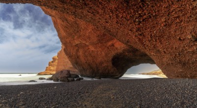 A view of the beach and rock arch at Legzira on the Atlantic Coast of Morocco