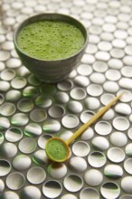 Matcha green tea from Japan on modern stainless steel background