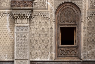 Fes, Morocco, April 04, 2023, Rich decorated facade in the courtyard of the Medersa Attarine in