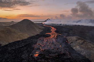 Drone image of a volcanic eruption in the evening light in Grindavik, Sudurnes, Iceland, Europe