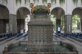 Decorative, Art Nouveau ceramic fountain made of majolica tiles, in the fountain house, Heilbad