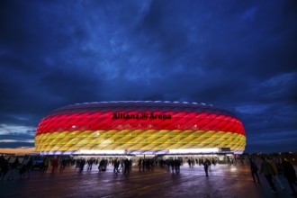 Night shot, stadium, illuminated, illuminated, in German national colours, black-red-gold, UEFA