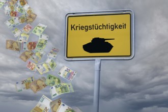 (Photomontage) Town entrance sign with a tank and the inscription KRIEGSTÜCHTIGKEIT against a