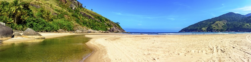 Panoramic image of tropical Bonete beach in Ilhabela with the river flowing into the sea, Bonete