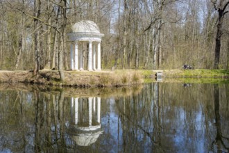 Diana Temple in Lützschena Castle Park with reflection in the water, Leipzig, Saxony, Germany,