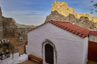 Small chapel with red tiled roof amidst ancient ruins and landscape, Archangelos, castle, place,