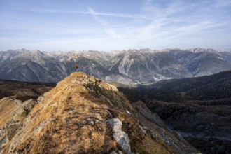Mountaineer on the ridge in front of a mountain panorama, view from the ridge of the Venet to