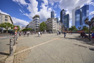 Modern buildings with skyscrapers under a blue sky and cumulus clouds at Opernplatz in Frankfurt am