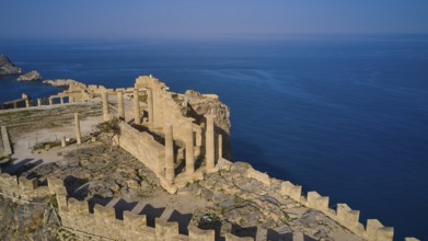 Drone shot, Acropolis of Lindos, late afternoon light, Temple of Athena Lindia, Ruins of an ancient