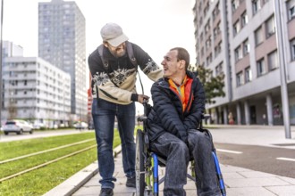 Tourist pushes his disabled friend in a wheelchair, both laughing and enjoying their time together