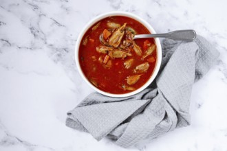 French shrimp bisque soup, on a marble table, close-up, no people