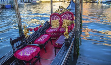 Luxury Gondola waiting for tourists near famous Rialto Bridge in Venice