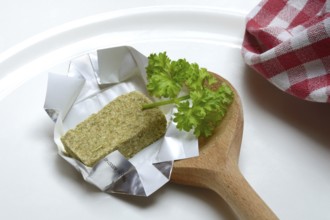 Stock cube with cooking spoon, soup cube
