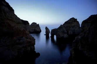 Blue hour in front of sunrise, rocks in the sea, Ponta da Piedade, Lagos, caves, cliffs, Atlantic
