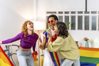 Multi-ethnic gay friends singing karaoke with toy mic celebrating pride at home