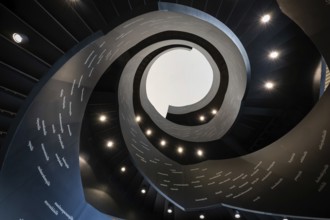 Spiral staircase printed with Finnish words, Oodi Central Library and Cultural Centre, designed by