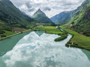 Mountain Eggenipa reflected in lake Bergheimsvatnet, south of Byrkjelo, Norway, Europe