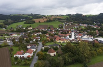 Drone shot, view of village with church, Enzenkirchen, Innviertel, Upper Austria, Austria, Europe
