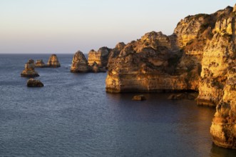 Colourful cliffs and rocks at sunrise on the beach, Praia da Dona Ana, Lagos, cliffs, Atlantic