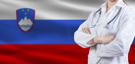 Doctor with crossed arms on slovenian flag, slovenia health and care concept, female doctor on