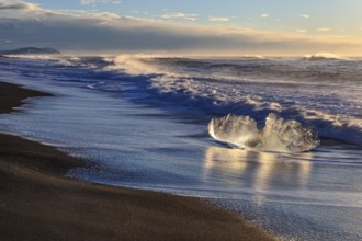 Ice floes on the beach, waves, sunny, morning mood, winter, Diamond Beach, Breidamerkursandur,
