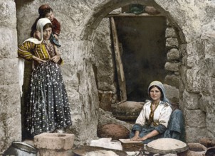 Peasant woman baking bread, Syria, Historical, digitally restored reproduction from a 19th century