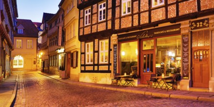 Half-timbered houses in a cobbled street, old town centre in the evening, World Heritage City of