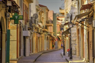 Venetian old town, old town alley almost deserted, colourful houses, cobbled alleyway, morning