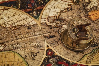 Travel geography navigation concept background, old vintage retro compass with sundial on ancient