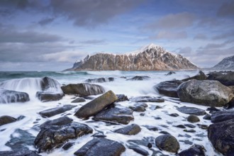 Rocky coast of fjord of Norwegian sea in winter. Skagsanden beach, Lofoten islands, Norway, Europe