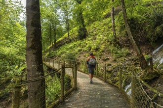 A male hiker on a mountain trail in the Borce commune of the French Pyrenees