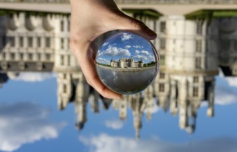 View of the Chateau de Chambord through a transparent ball. Loir-et-Cher department, Centre-Val de