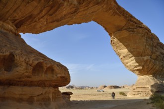 Tourists at The Arch, also known as Rainbow Rock, near AlUla, Medina Province, Saudi Arabia,