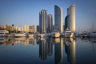 Busan marina with yachts, Marina city skyscrapers with reflection on sunset, South Korea, Asia