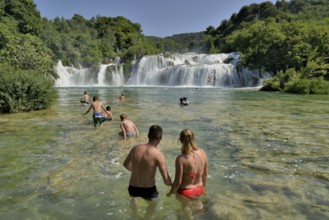 Tourists taking a bath at the Skradinski buk waterfalls, Krka National Park, Šibenik-Knin County,
