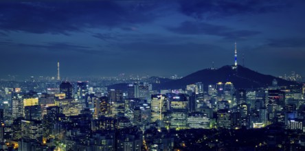 Panorama of Seoul downtown cityscape illuminated with lights and Namsan Seoul Tower in the evening