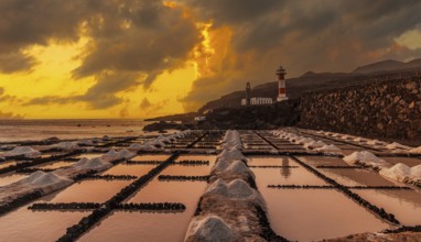 Sunset at the Fuencaliente Lighthouse next to the salt flats, on the route of the volcanoes south