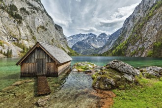 Boat dock hangar on Obersee mountain lake in Alps. Bavaria, Germany, Europe