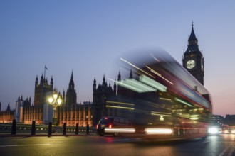 Red double-decker bus on Westminster Bridge, blue hour, Big Ben in the background, Westminster,