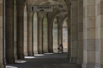 Two men boxing in the arcade of the Congress Hall, unfinished National Socialist monumental