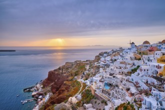 Famous greek iconic selfie spot tourist destination Oia village with traditional white houses and