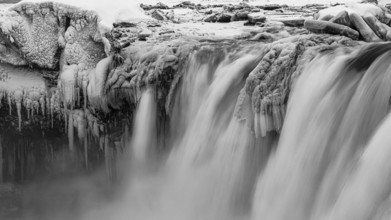 Godafoss waterfall, icy and snowy rock face, black and white photo, Northern Iceland Eyestra,