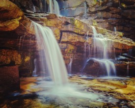 Vintage retro effect filtered hipster style image of tropical waterfall. Popokvil Waterfall, Bokor