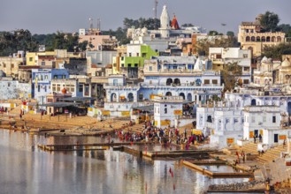 PUSHKAR, INDIA, NOVEMBER 20, 2012: Hindu devotees pilgrims bathing in sacred Puskhar lake (Sagar)