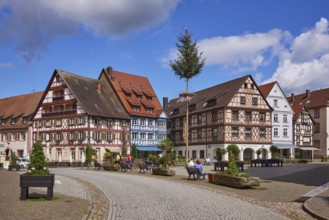 Market square with maypole, benches, flower tubs and half-timbered houses in Gengenbach, Black