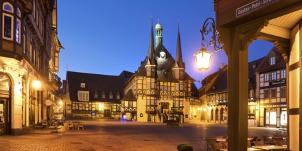 Market square with atmospherically illuminated town hall in the evening, Wernigerode, Harz,