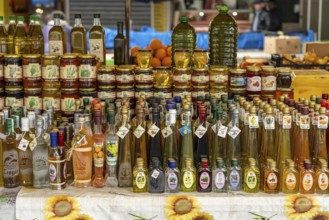 Liqueurs, schnapps, honey and olive oil at the market in Trogir, Croatia, Europe