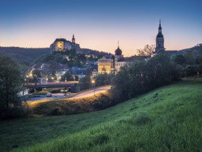 Town view with Upper Castle, Lower Castle and St Mary's Church at dusk, Greiz, Thuringia, Germany,