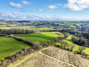 Farms over Road A35 from a drone, Morcombelake Village, Bridport, Dorset, England, United Kingdom,
